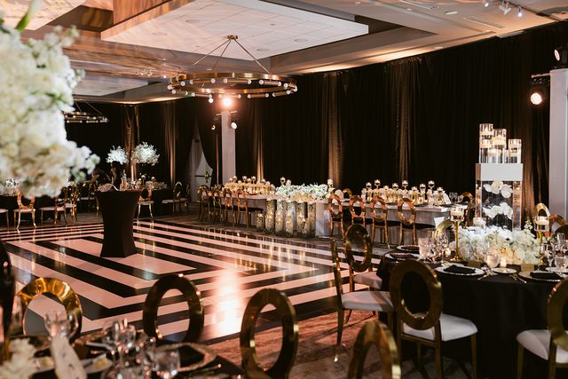 Featured photo from This Black-and-Gold Wedding at PGA National Resort & Spa Was Meant To Be with Tall White Florals and a Dramatic Dance Floor