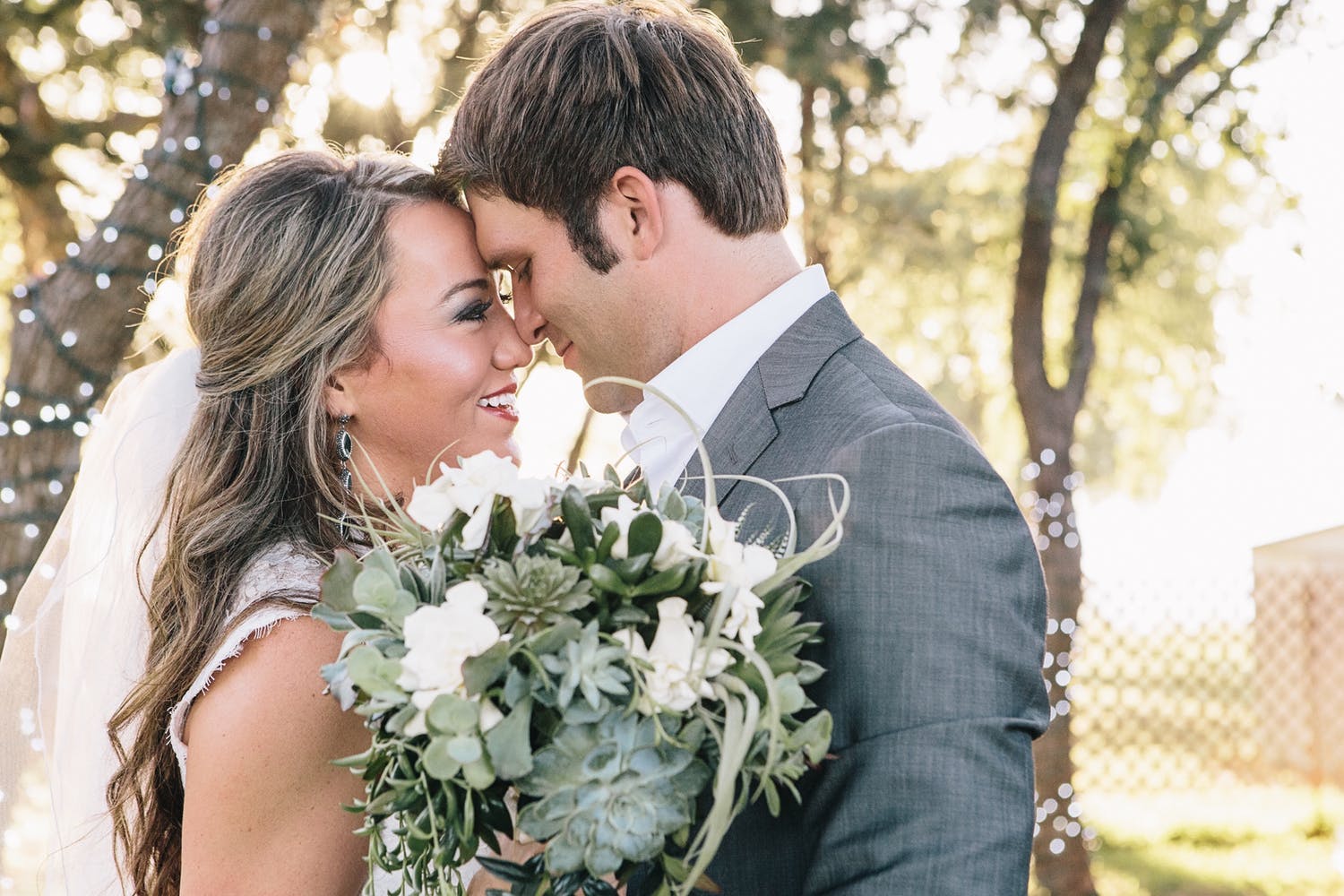 portrait of bride and groom about to kiss