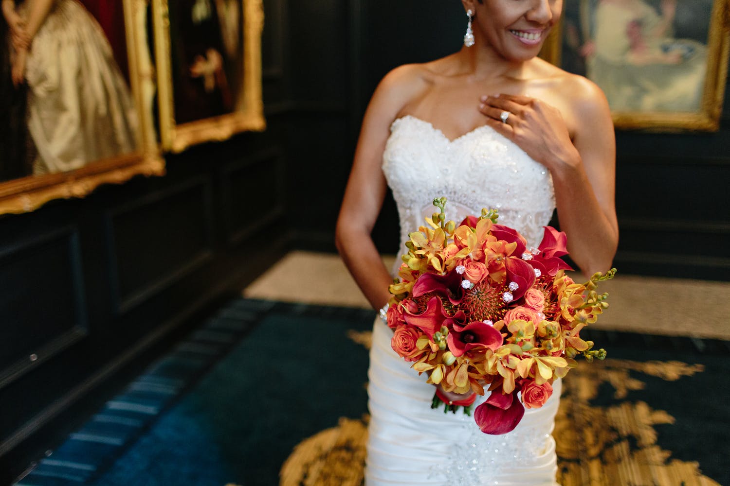 cropped portrait of bride with vibrant bouquet