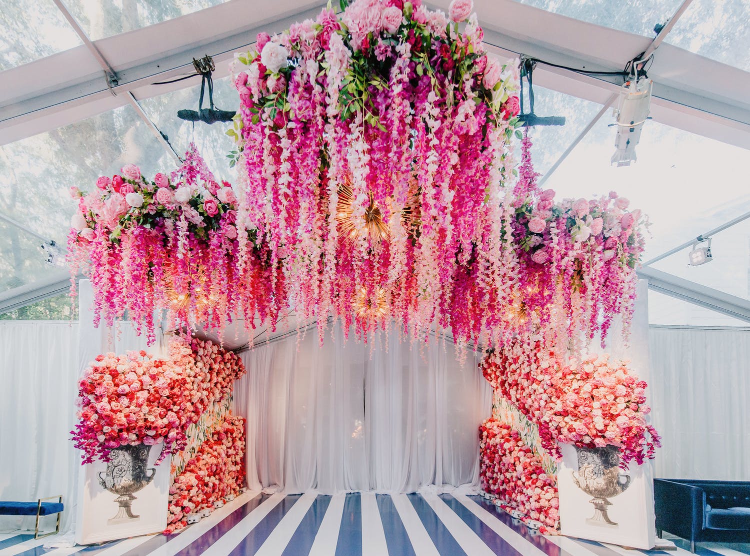 Ceremony alter with suspended pink blooms | PartySlate