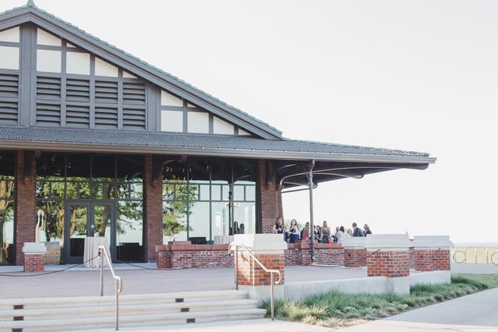 Modern building with glass panels and vast view at Theater on the Lake | PartySlate