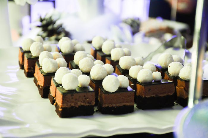 Chocolate mousse 3 layered desert topped with white marshmallow balls | PartySlate