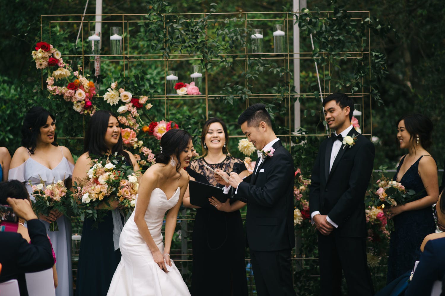 bride and groom exchanging vows | PartySlate