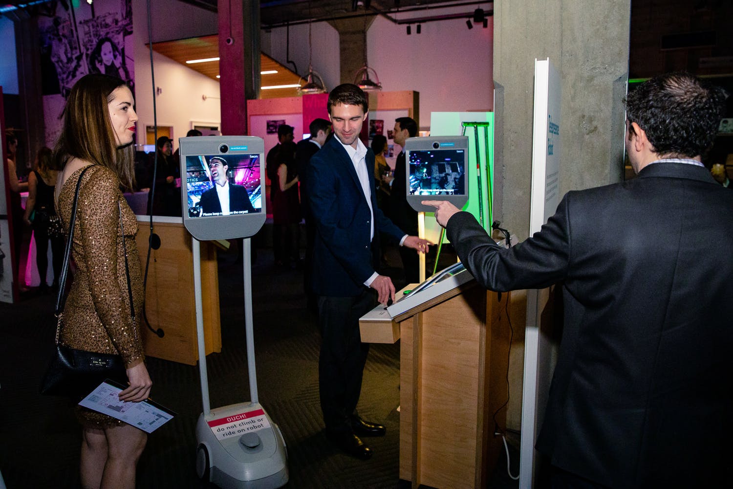 Guests interacting with iPad selfie station | PartySlate