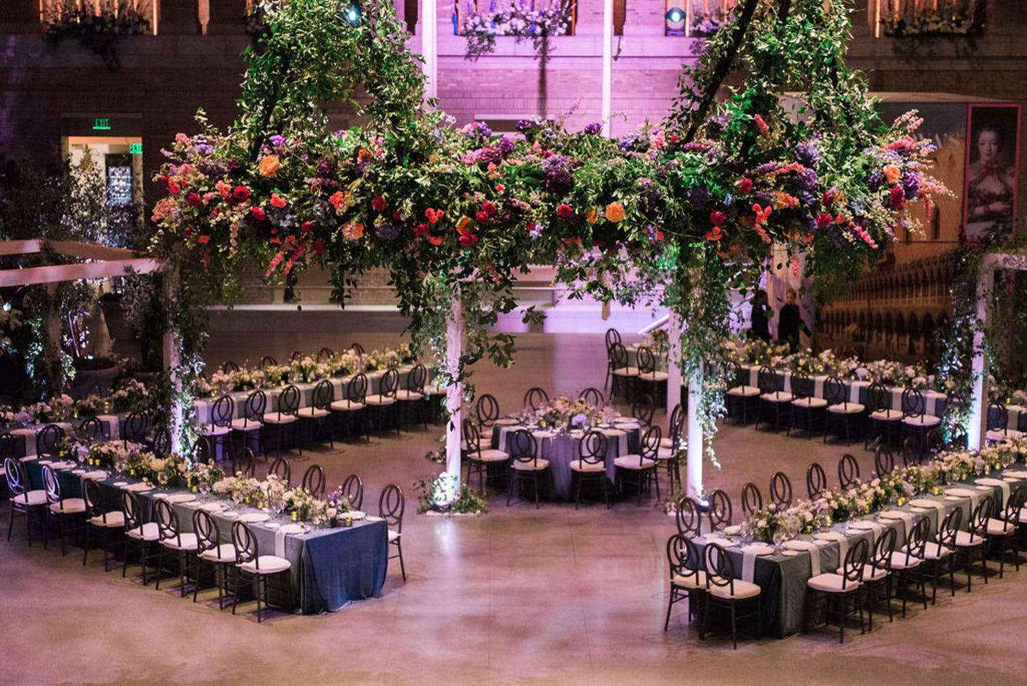 reception area with diamond table formations and lavish foliage