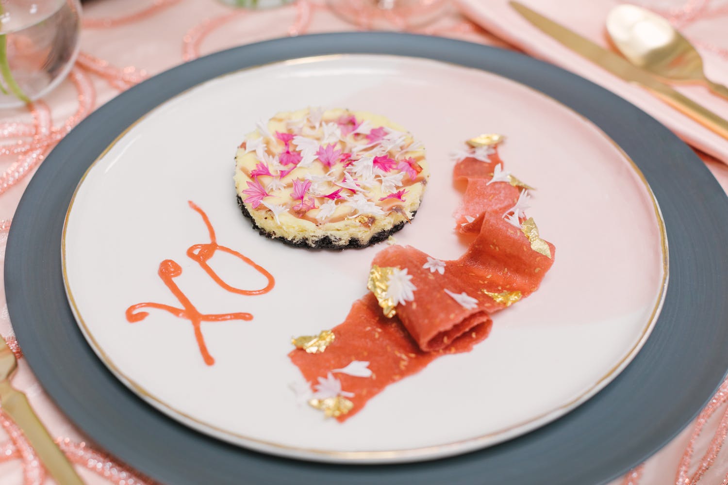 artfully-plated dish with XO spelled out in sauce