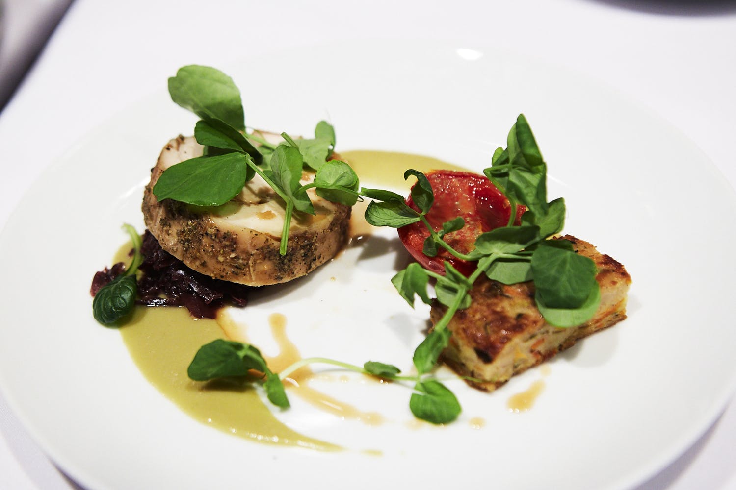 artfully plated fish and herbs