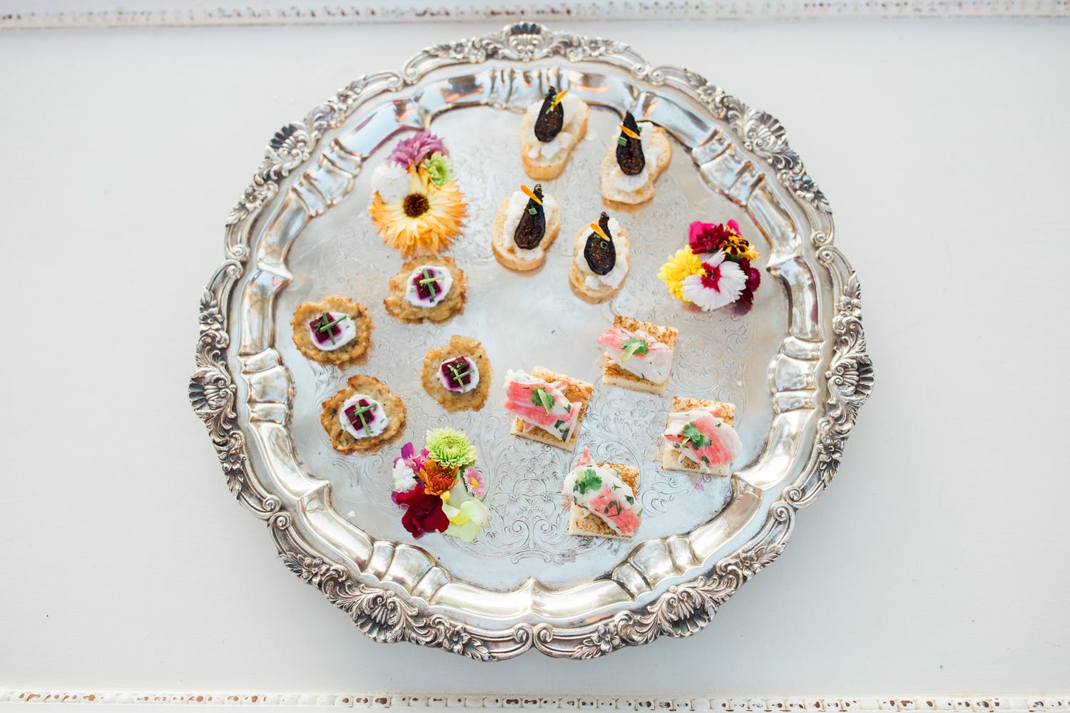 small bites served on seashell plate
