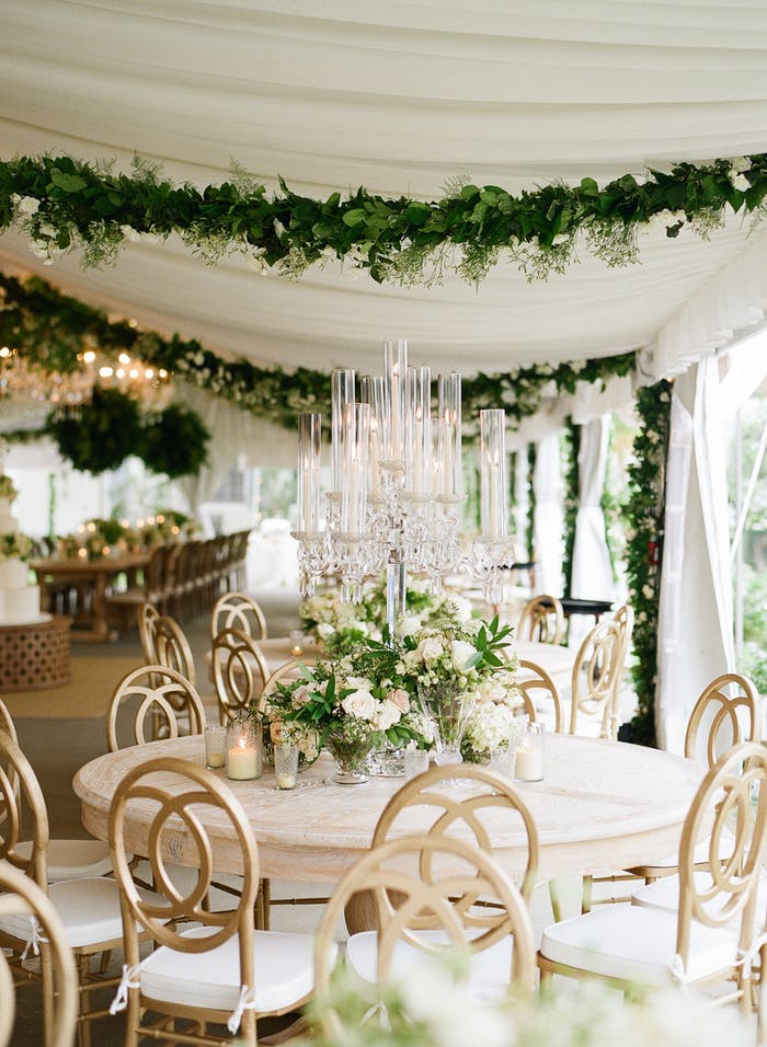 White wedding reception with greenery