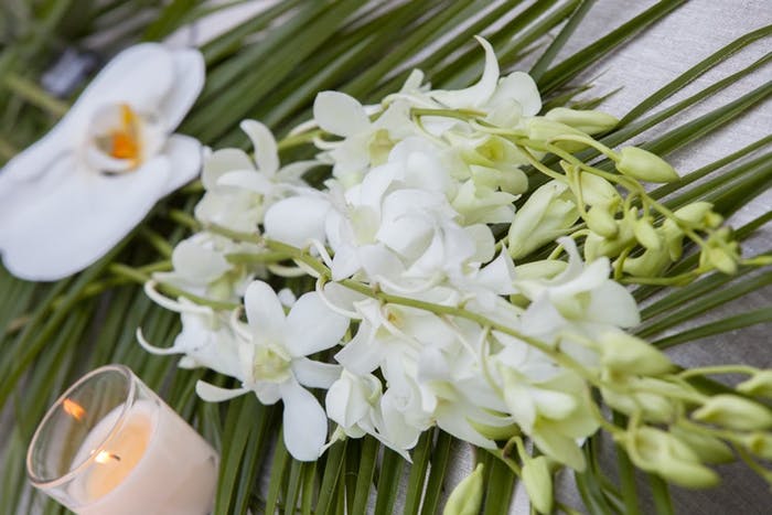 Tropical White and Green Floral Décor and Votive Candle | PartySlate