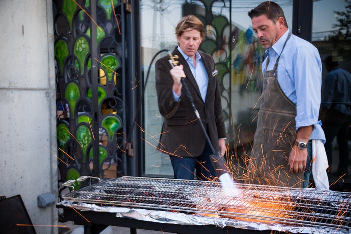 Two Men Cooking at 50th Birthday Party Oyster Roast | PartySlate