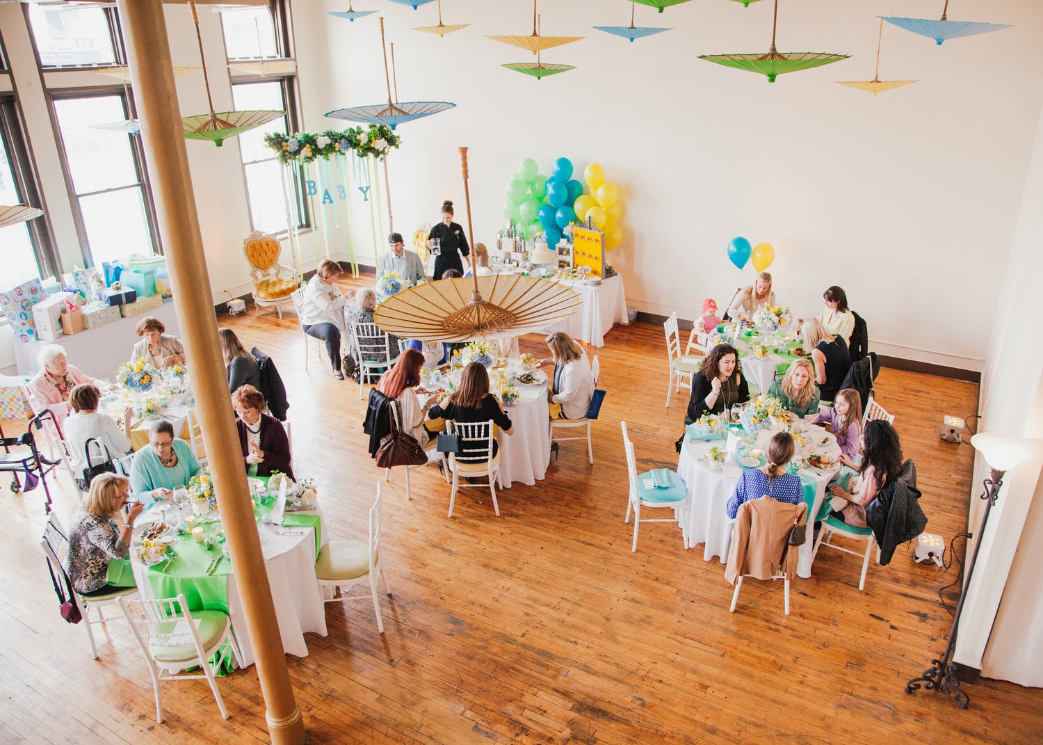 Creativo Loft Baby Shower Venue in Chicago, IL With Umbrella Ceiling Décor