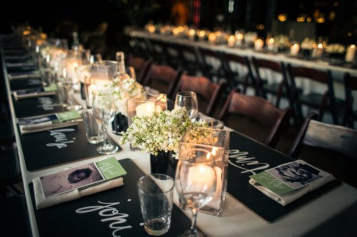 Birthday Party Tablescape With Candlelight and Black Décor Accents | PartySlate
