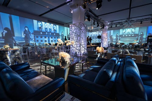 Birthday Party With Blue Furnishing, Blue Uplighting, and Geometric Décor | PartySlate