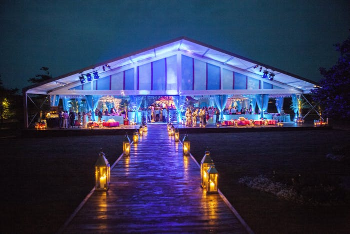 Transparent Party Tent With Blue Uplighting | PartySlate