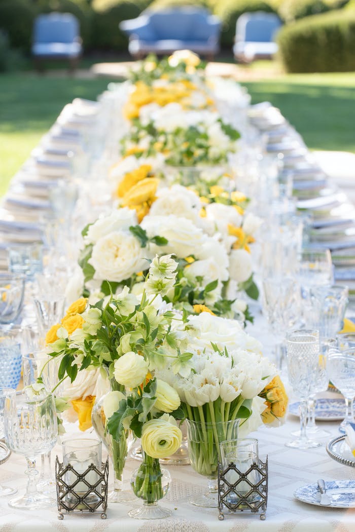 White and yellow floral centerpieces