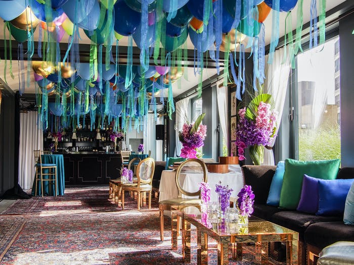 balloons covering the ceiling with windows