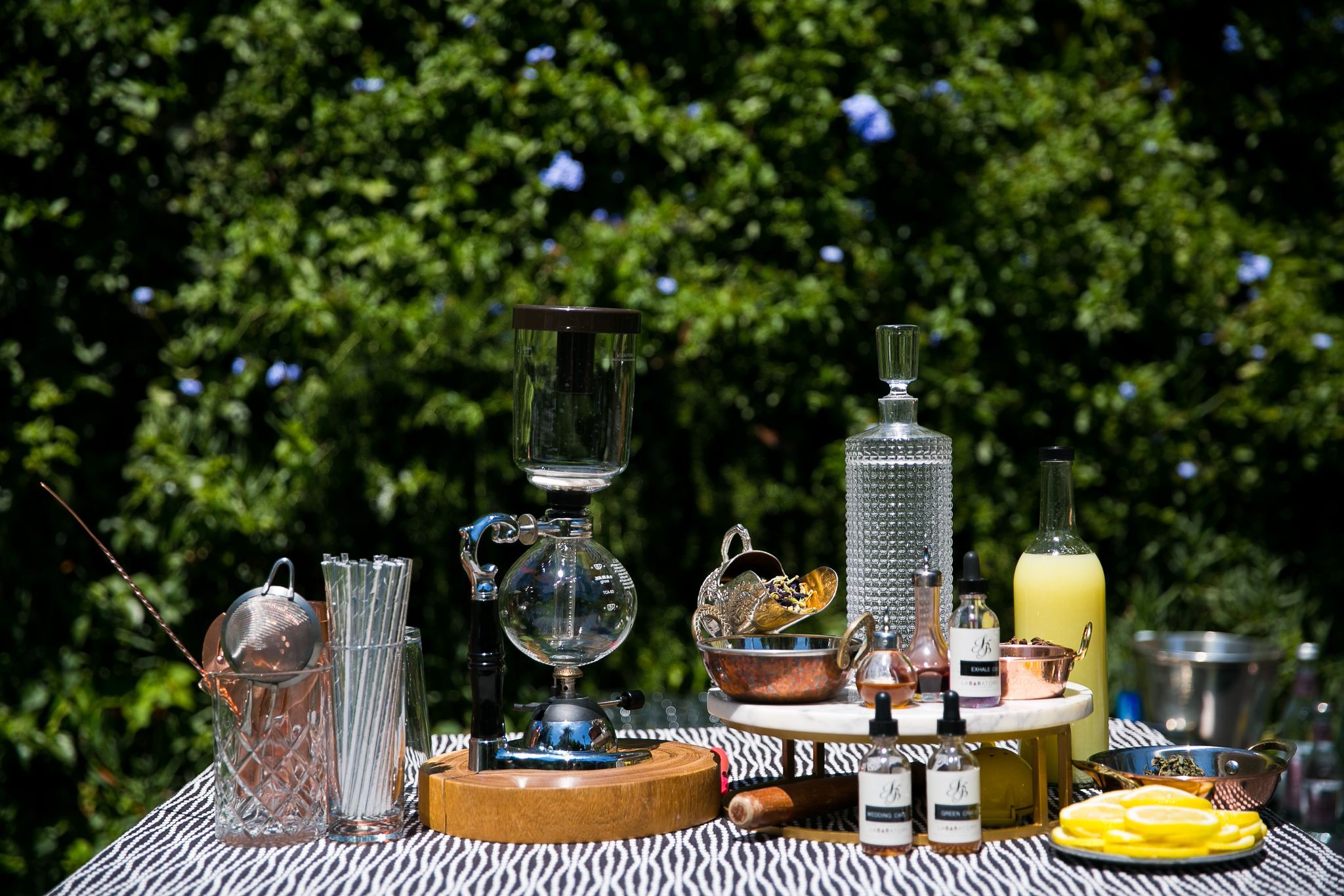 Bartending station vodka transformed into gin and with cannabis infusions.