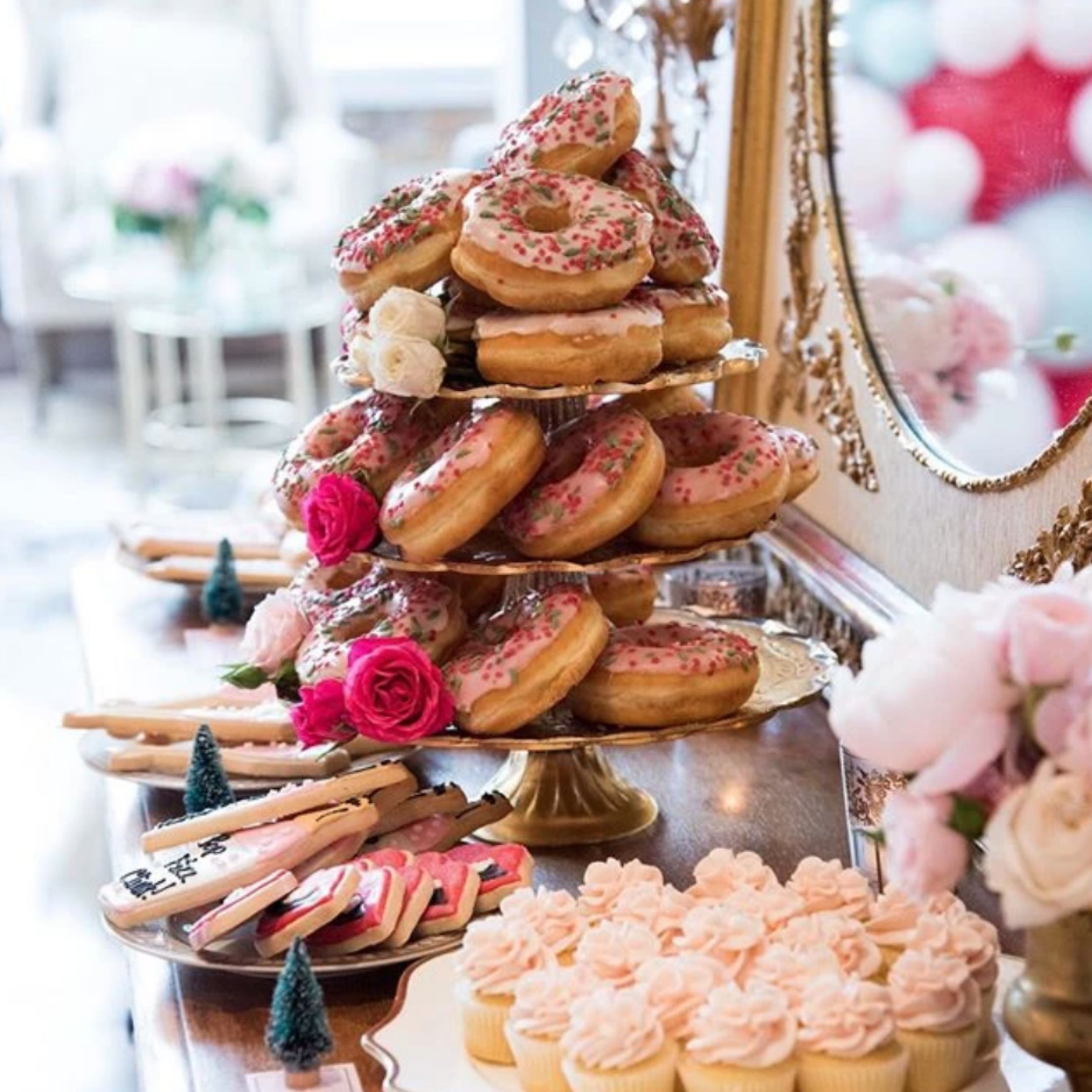 IntoxiCakes donuts on tiered tray.