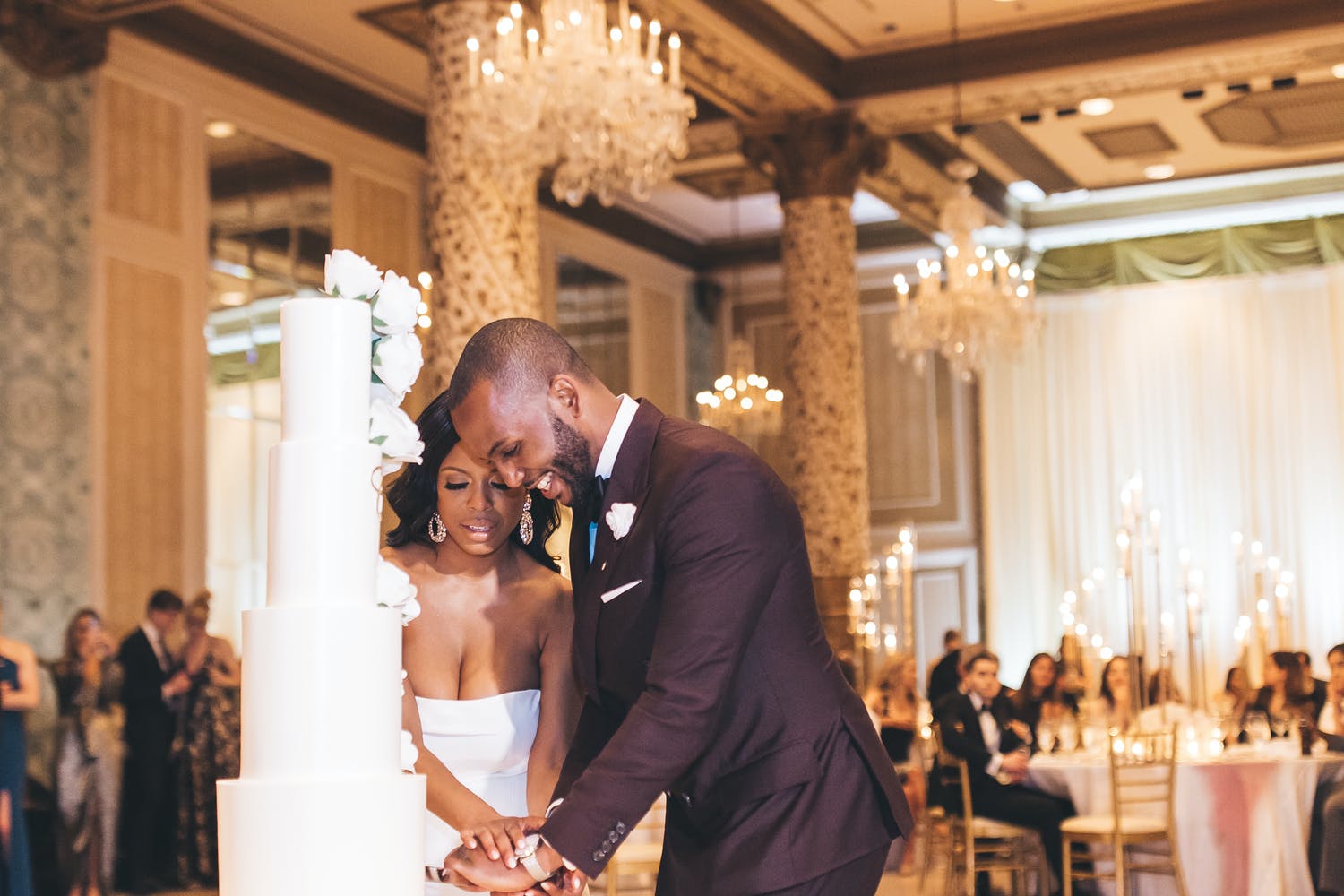 Cake cutting at modern Drake Hotel wedding.