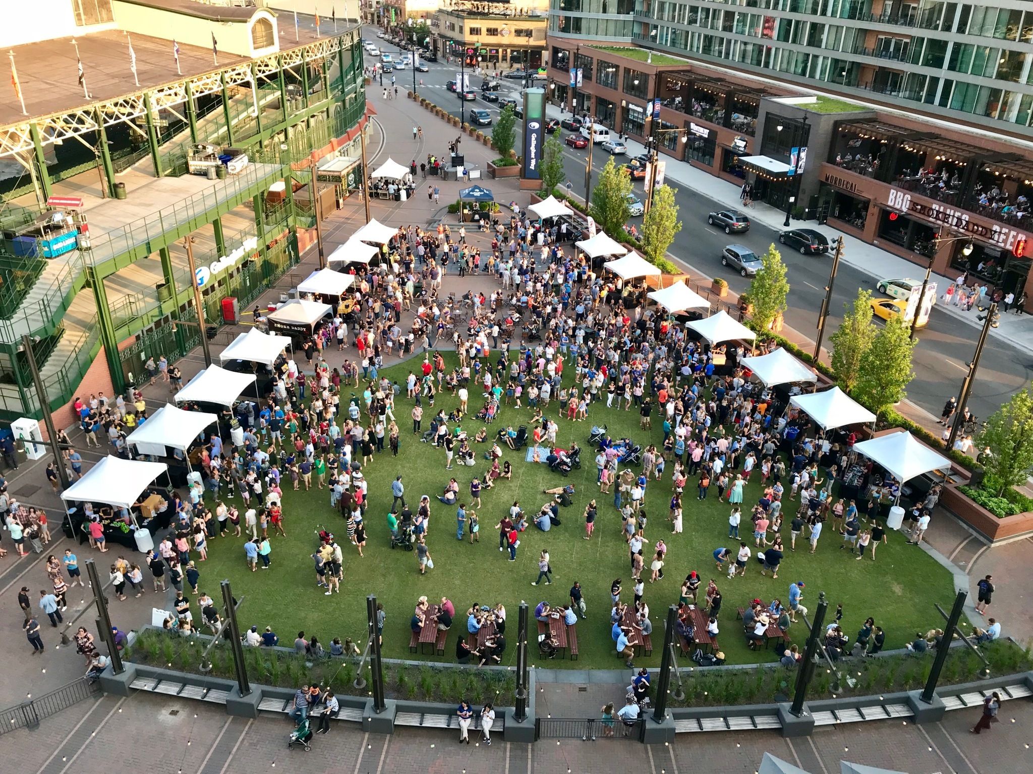 Crowded green plaza next to Wrigley Field, Chicago | PartySlate