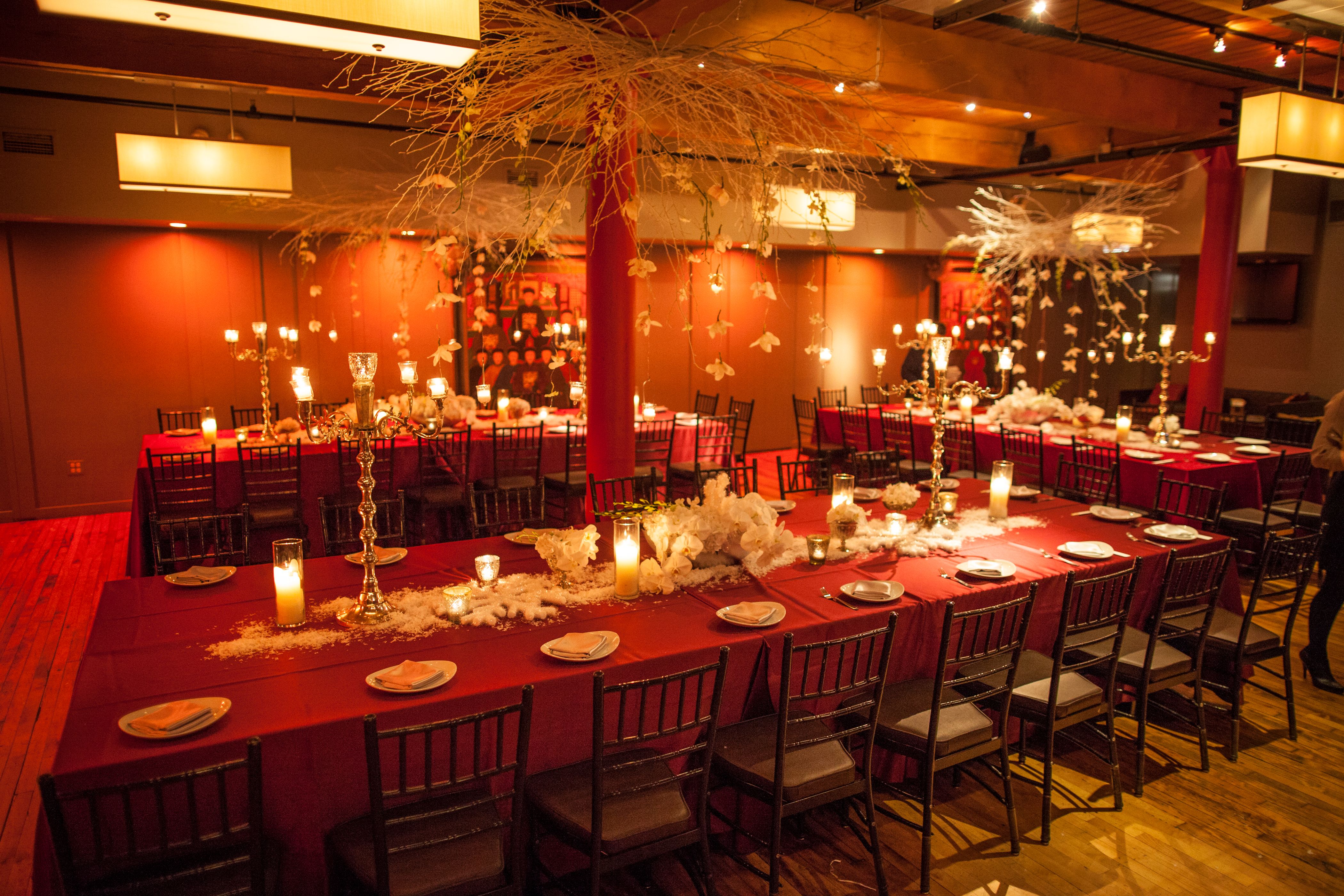 Bright red themed event space with long tables in Chicago | PartySlate