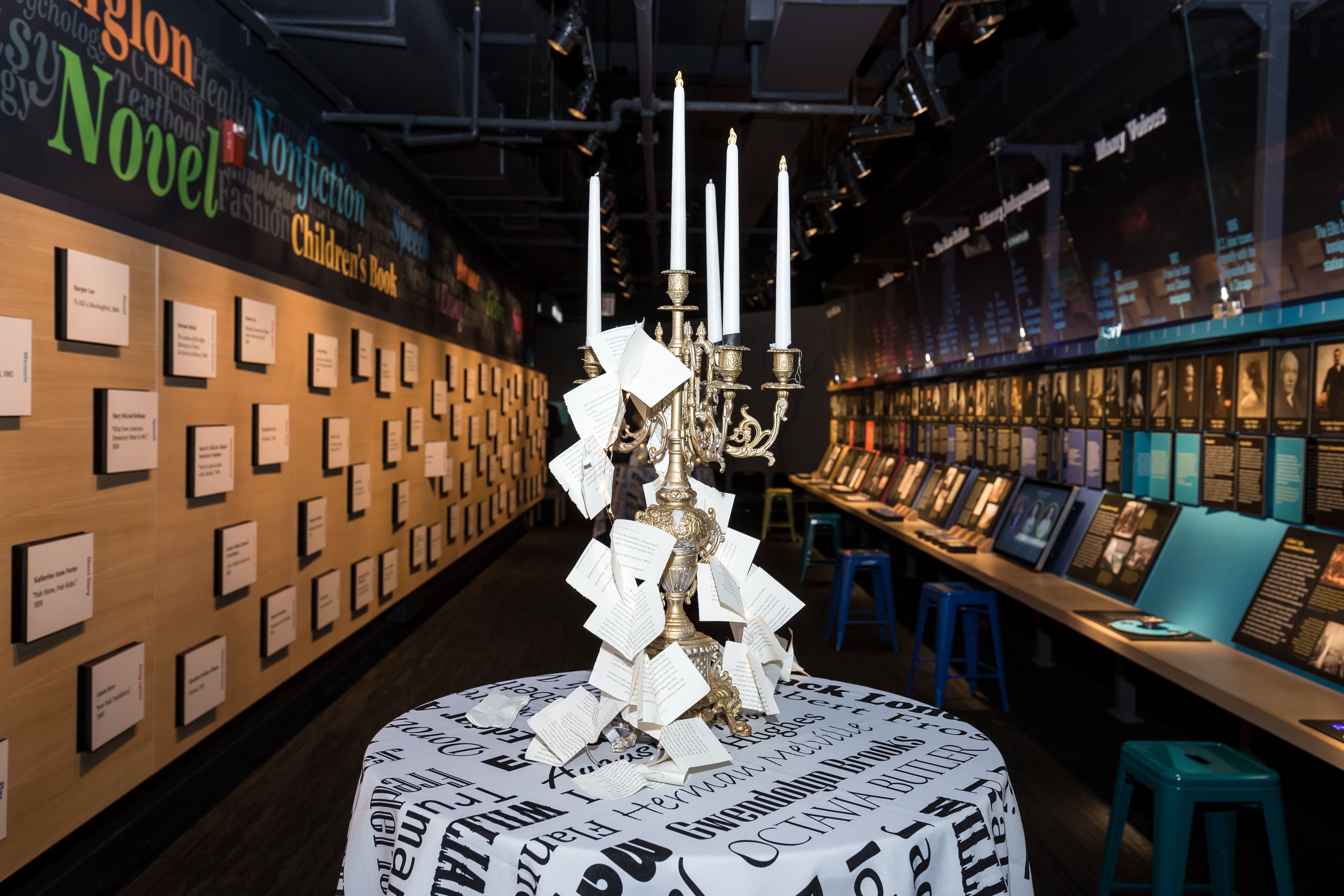 Writers museum Chicago event with large candelabra on a newspaper print tablecoth | PartySlate