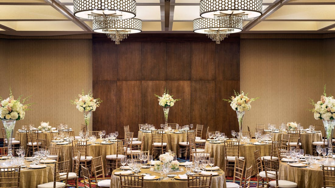 Wedding with Tall Flower Centerpieces in Cream and Wood Paneled Plaza Ballroom at Dallas Marriott Downtown | PartySlate