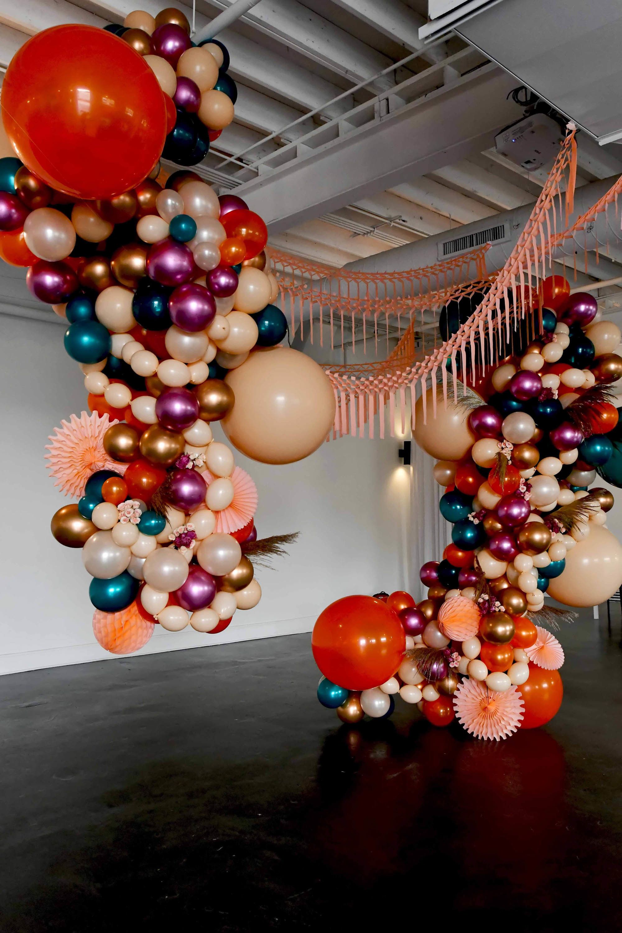 Vibrant pastel colored balloon installation
