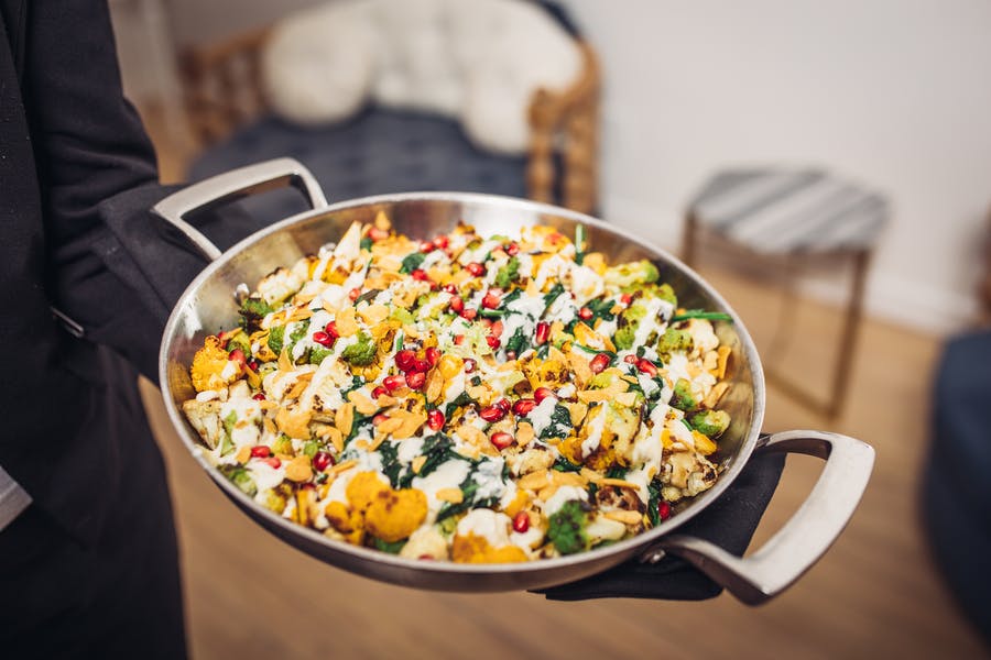 Colorful dish served in a silver bowl | PartySlate