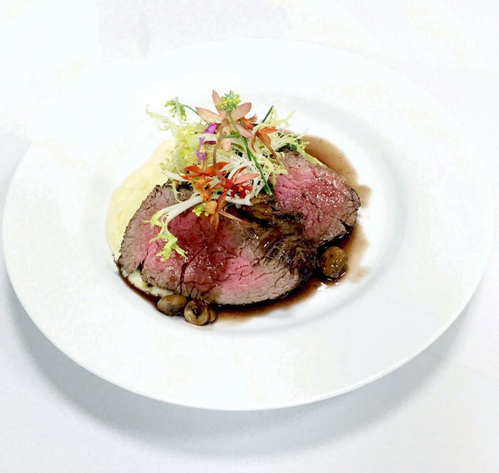 Steak served on a white plate | PartySlate