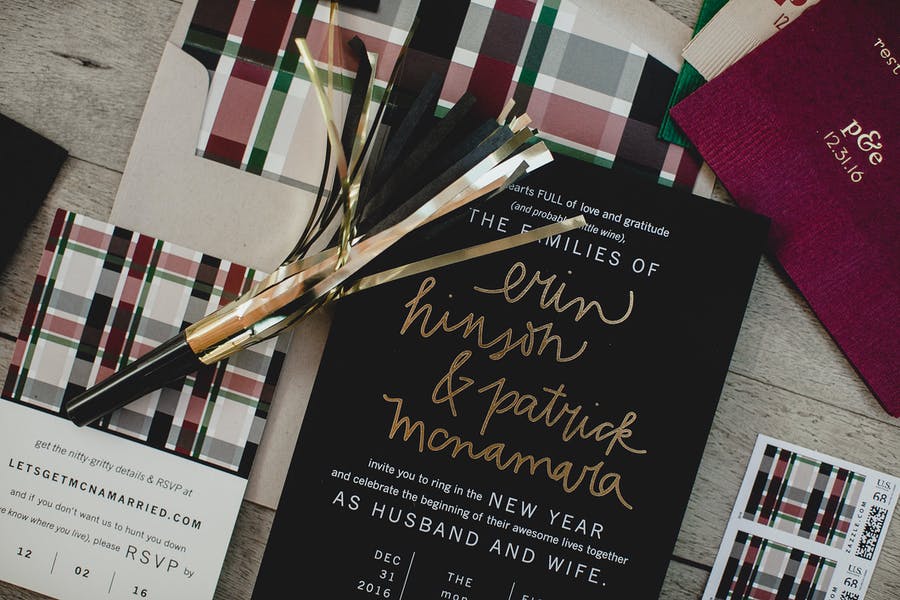 Winter-inspired invitations with gold lettering and flannel patterns