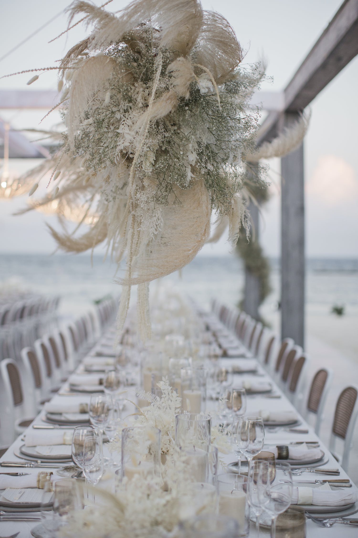 Beach tablescape with a baby's breathe centerpiece