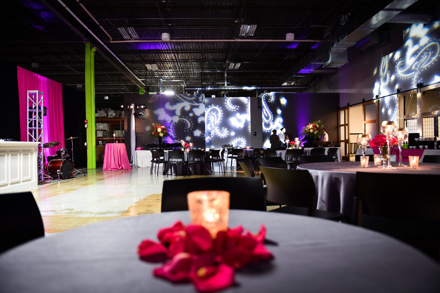 40th Birthday at industrial Venue With Paisley Wall Lighting | PartySlate