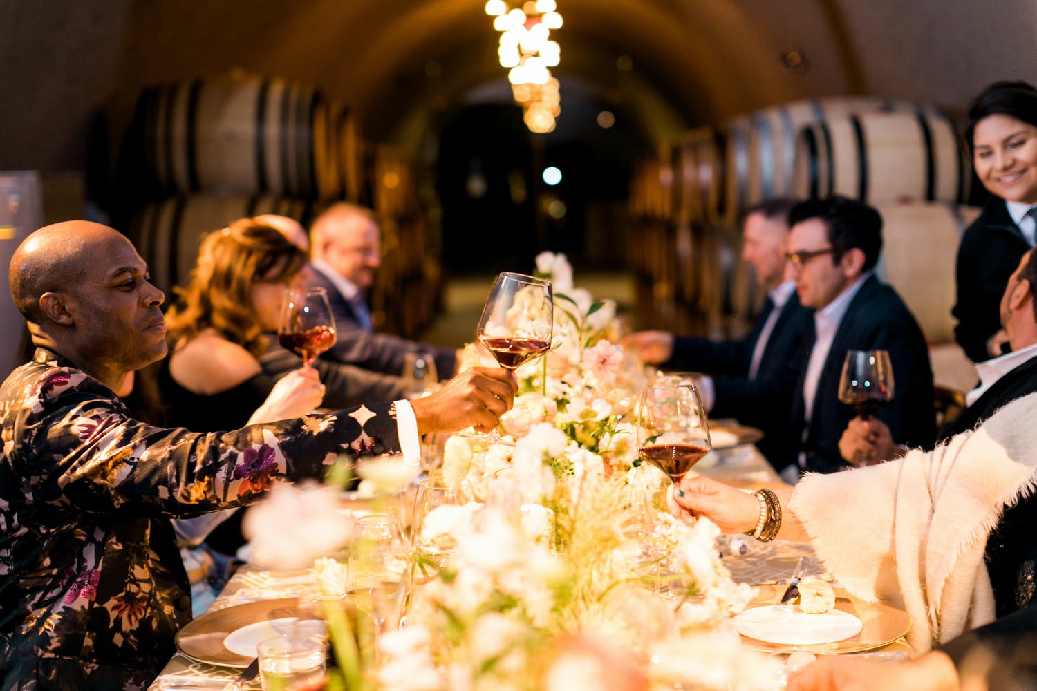 40th-Birthday Party Dinner Set Between Wine Barrel Walls | PartySlate