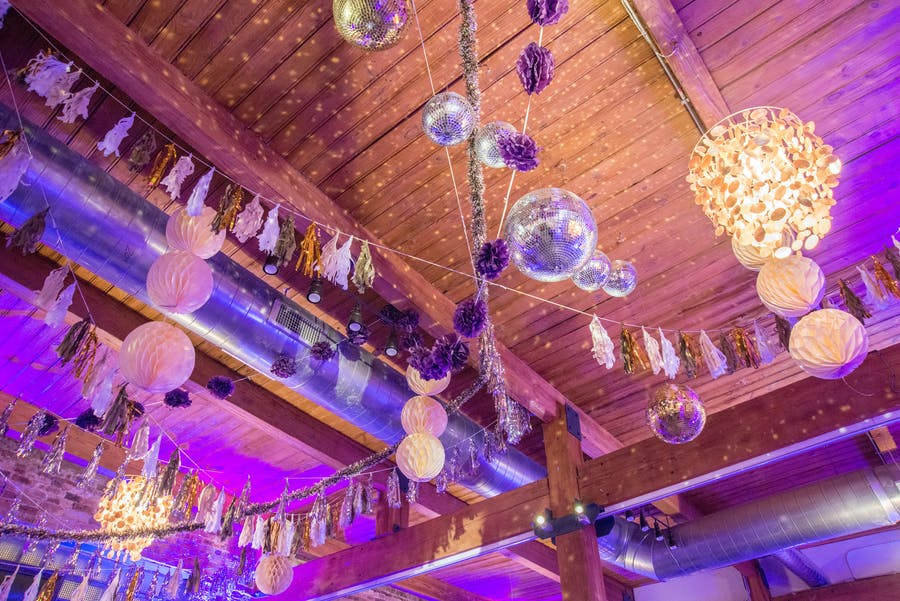 Birthday bash in Chicago with disco balls and purple ceiling decor | PartySlate
