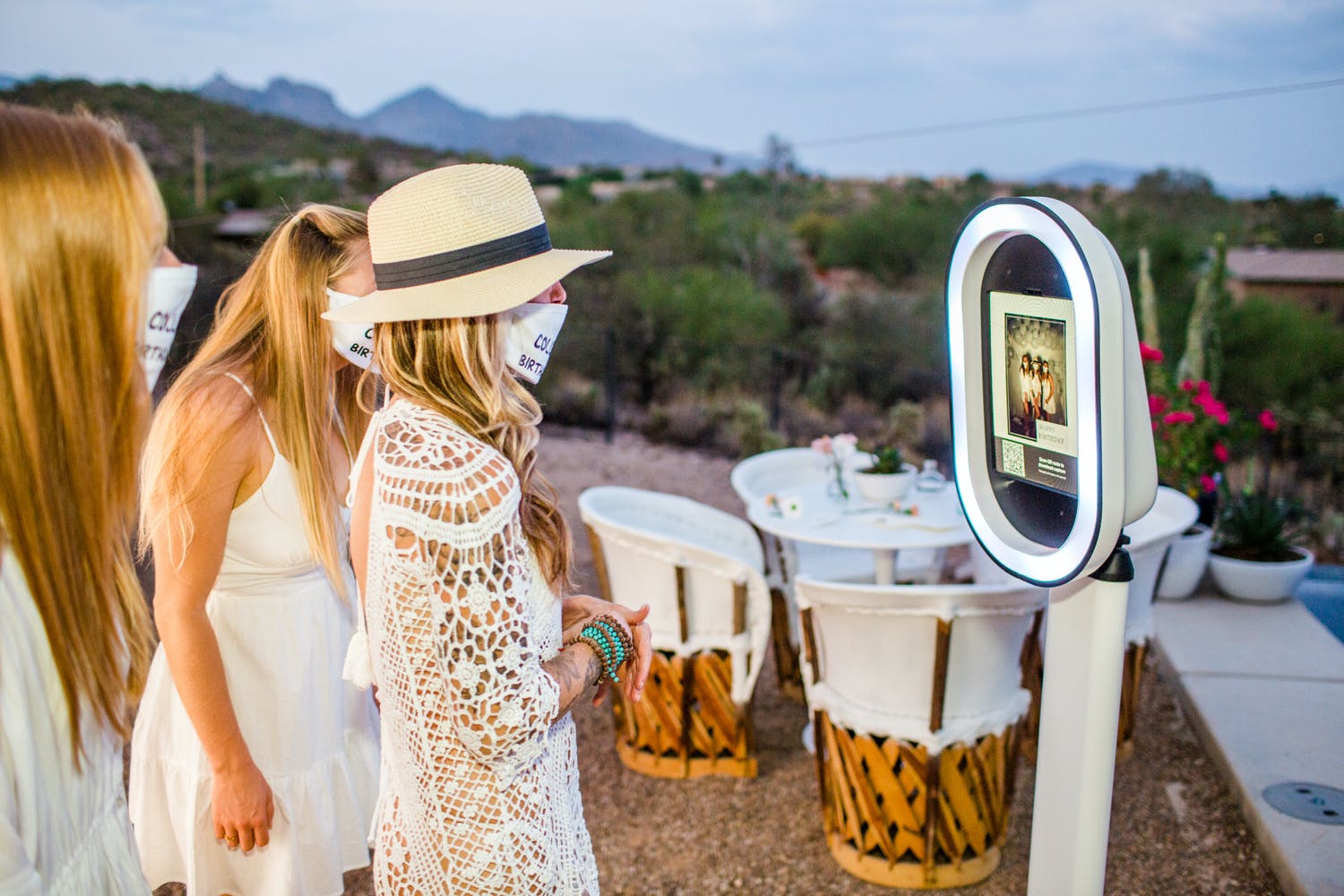 Friends in Masks Pose at Touchless Photo Booth For 50th Birthday Party | PartySlate
