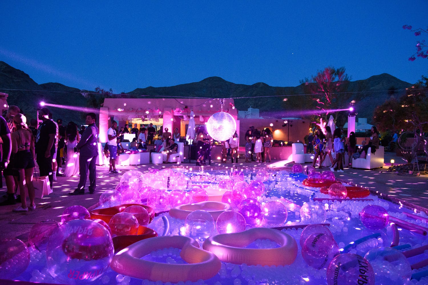 Nighttime Disco-Themed Pool Party With Iridescent Pool Floaties | PartySlate