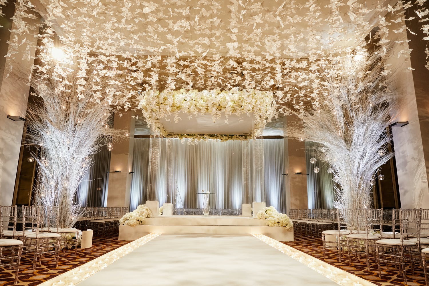 White Wedding Ceremony at The Standard Club With Butterfly Ceiling Installation | PartySlate