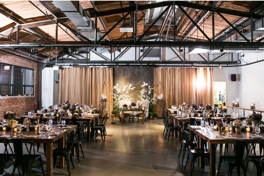 Rustic Chic Wedding Reception at Ovation in West Loop With Dark Wooden Beams | PartySlate