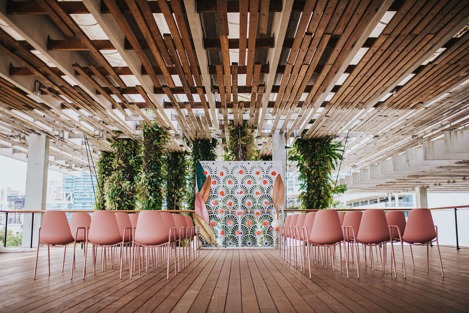 Contemporary Ceremony at Pérez Art Museum With Pink Seating and Eclectic Backdrop | PartySlate