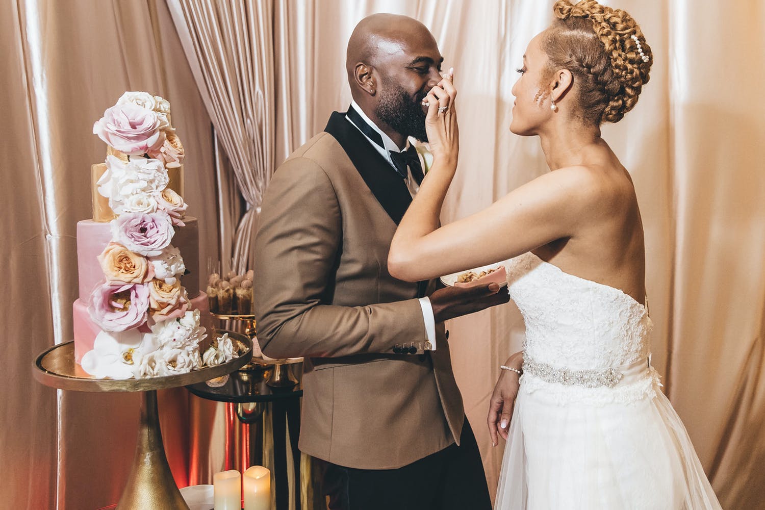 Bride Feeds Groom a Slice of Custom-Designed Pink Cake With Florals | PartySlate