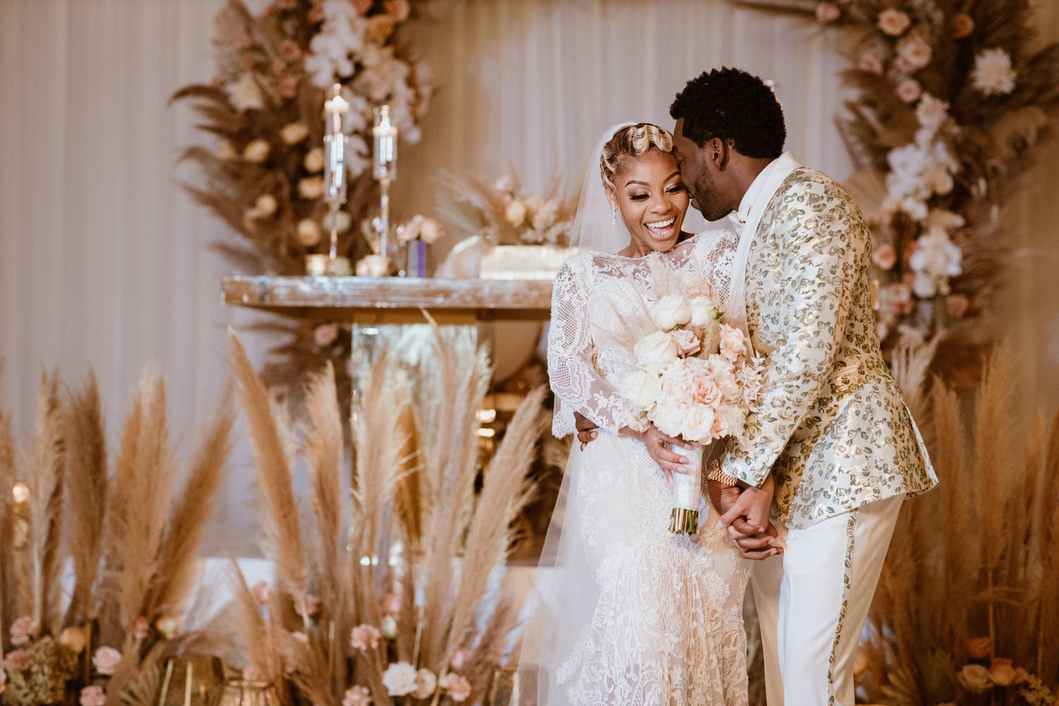 Couple Leans into Each Other at Boho Chic Weddding | PartySlate