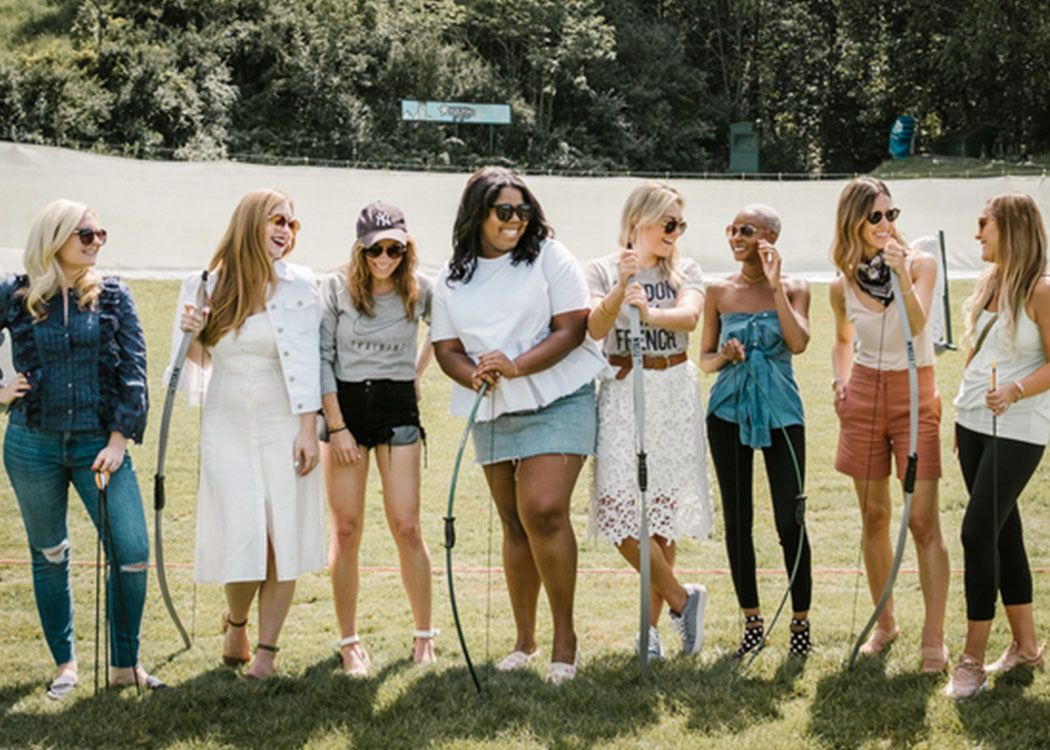 Six Ladies Hold Archery Bows at Grand Geneva Resort & Spa in Lake Geneva, WI | PartySlate