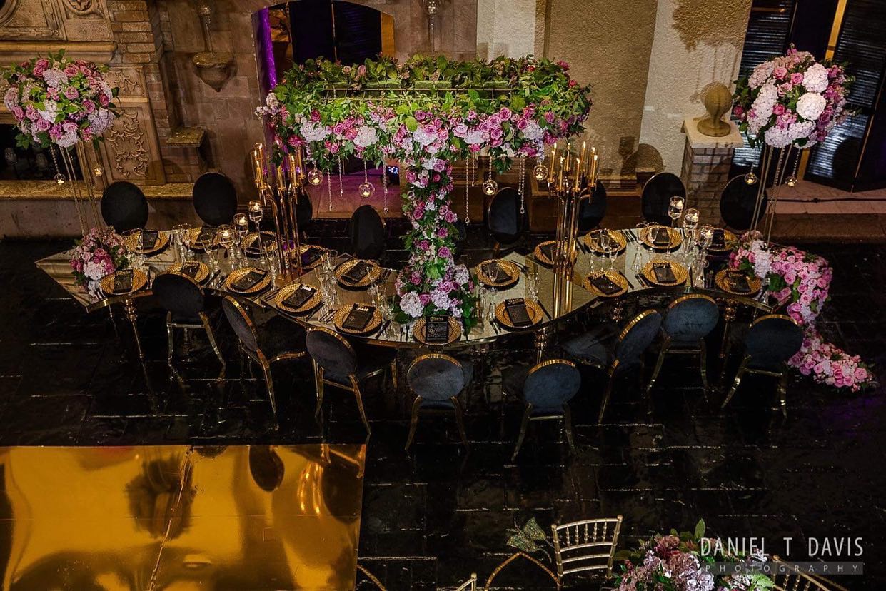 Glamorous and Modern Undulated Tablescape with Elevated Greenery and Purple Centerpieces by A Dream To Remember Events in Houston, TX | PartySlate