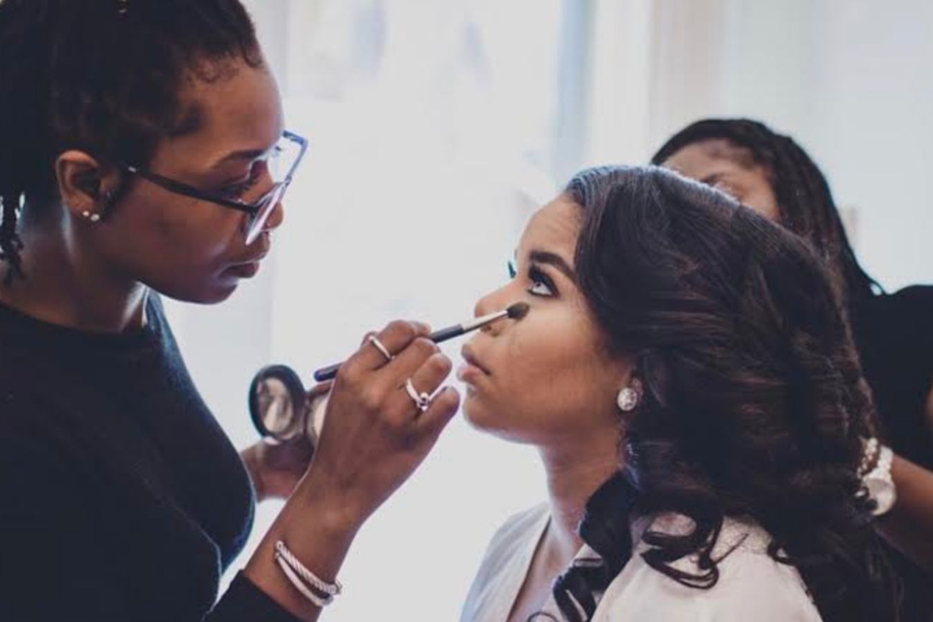 Tonia O Artistry puts makeup on a bride for her wedding day | PartySlate