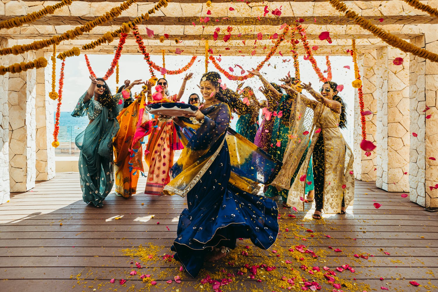Bride and bridesmaid dance at Traditional Glam Destination Wedding in Cancún, Mexico | PartySlate