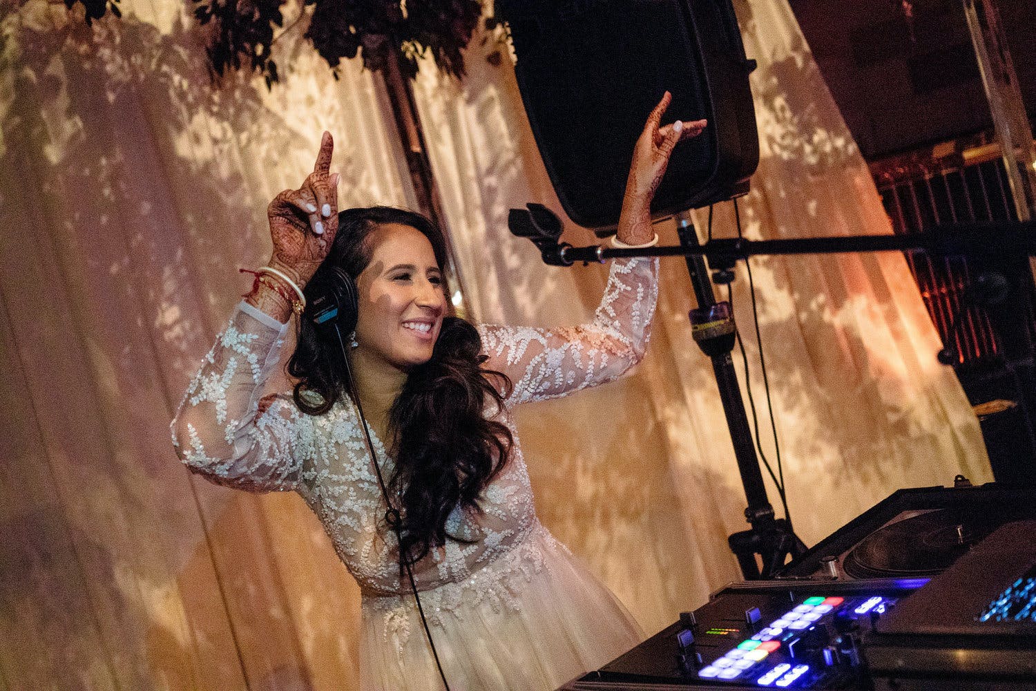 Bride djs at South Asian wedding | PartySlate