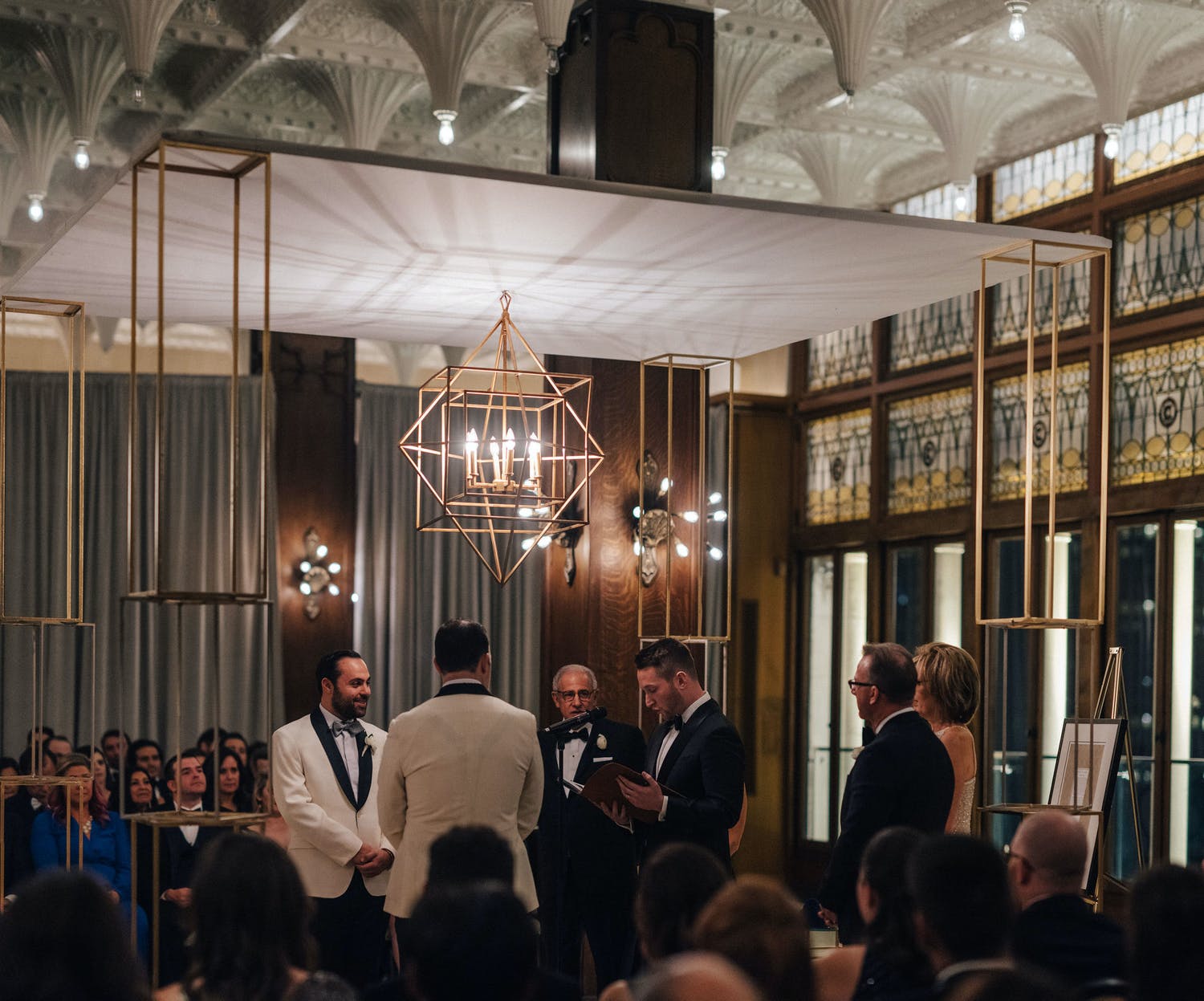 Chuppah with geometric chandelier | PartySlate
