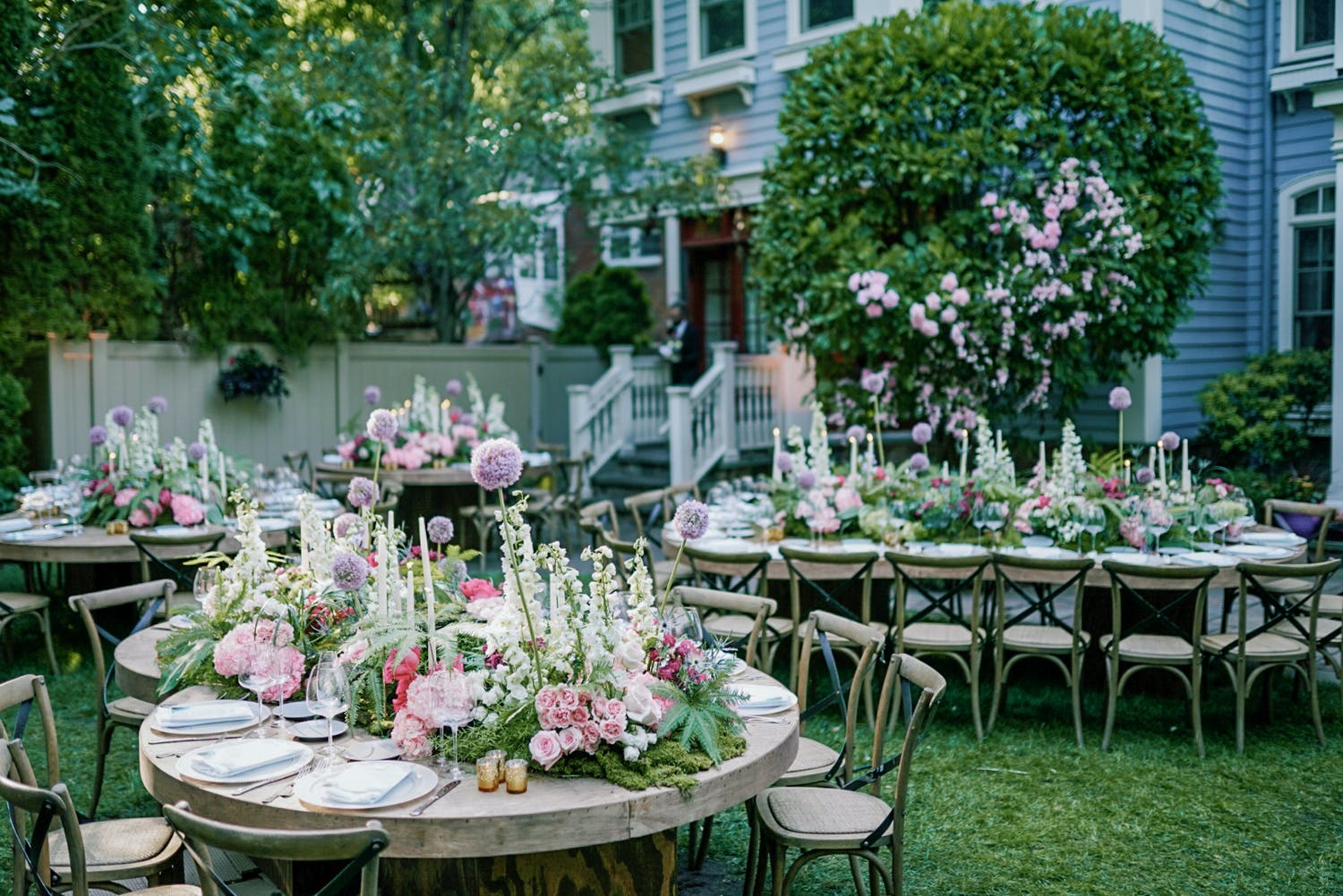 A colorful outdoor wedding at a private residence with garden-inspired centerpieces | PartySlate